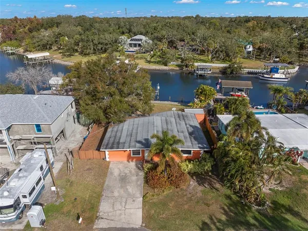 an aerial view of a house with a lake view
