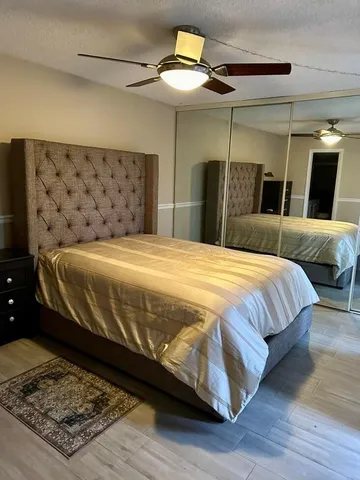 a bedroom with a bed and a walk in closet