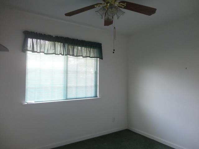 521 W West 9th Street Merced, CA 95341 - Photo 11 of 21 an empty room with a window