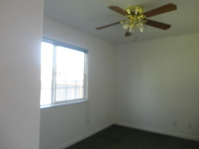 521 W West 9th Street Merced, CA 95341 - Photo 12 of 21 an empty room with a window