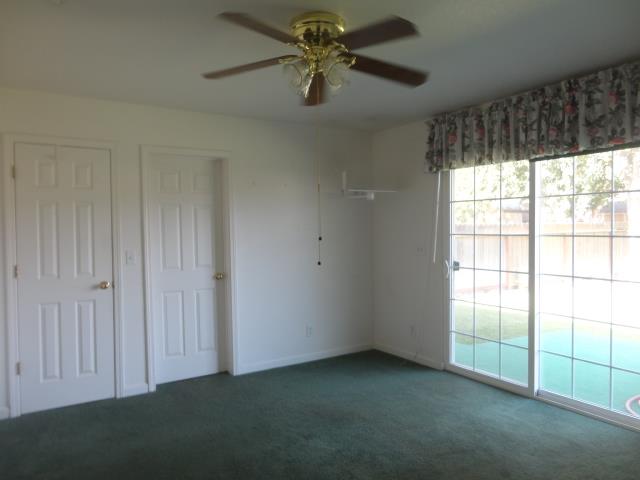 521 W West 9th Street Merced, CA 95341 - Photo 13 of 21 an empty room with a window
