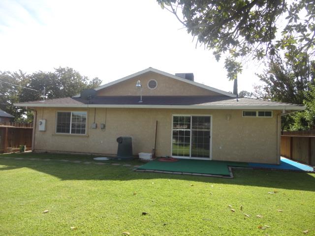 521 W West 9th Street Merced, CA 95341 - Photo 17 of 21 a house view with a garden space