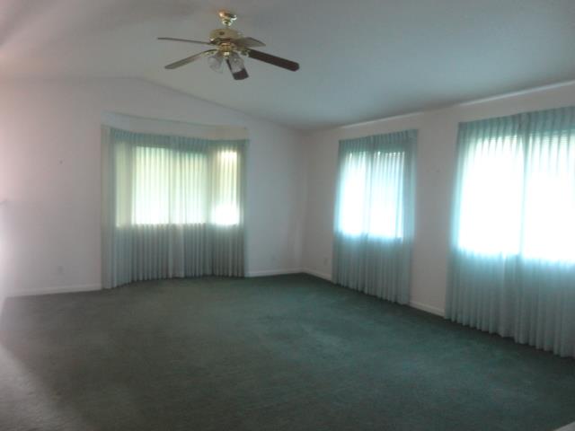 521 W West 9th Street Merced, CA 95341 - Photo 8 of 21 a view of empty room with windows