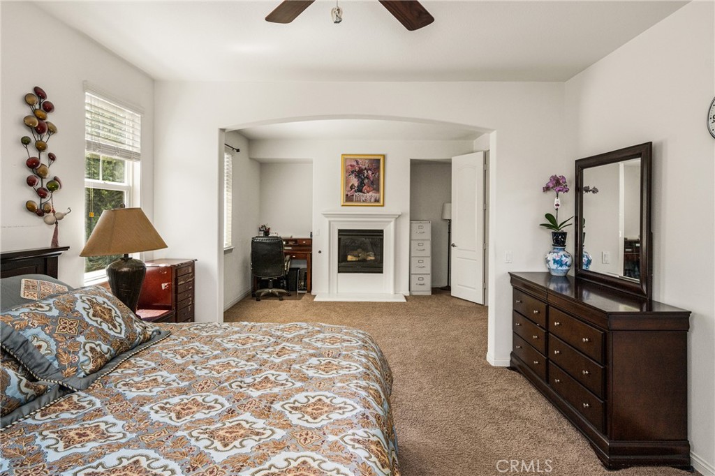 12652 Twin Peak Court Riverside, CA 92503 - Photo 28 of 55 a bedroom with furniture and a fireplace