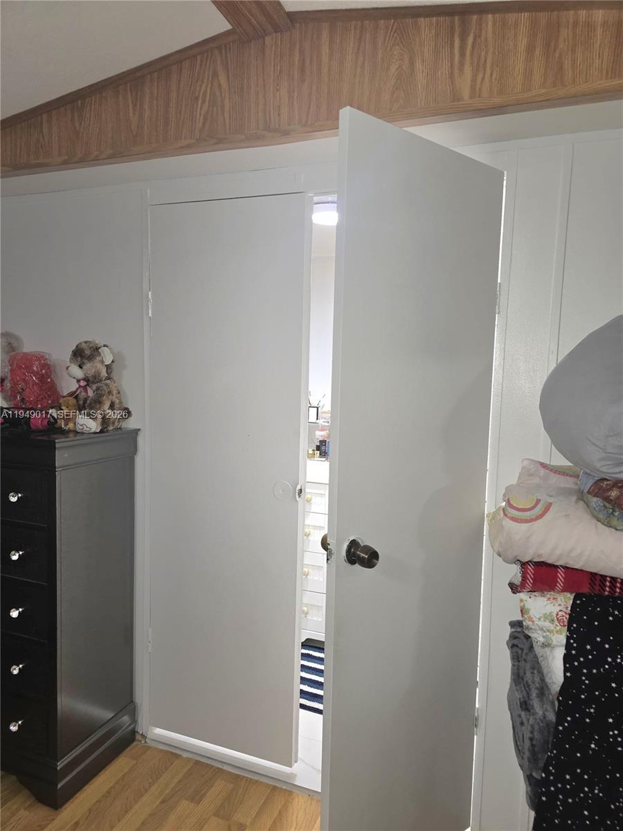 575 Vero Avenue Clewiston, FL 33440 - Photo 18 of 32 a view of an entryway with wooden floor