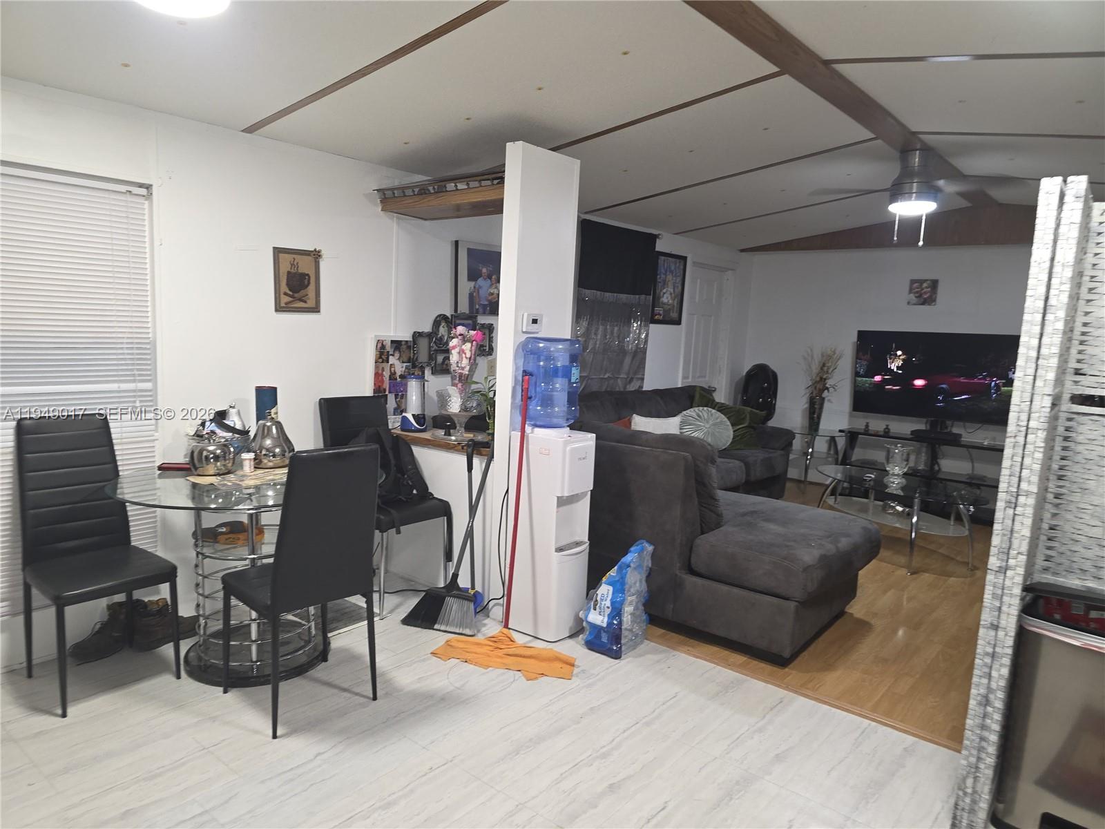 575 Vero Avenue Clewiston, FL 33440 - Photo 24 of 32 a living room with furniture and a fireplace