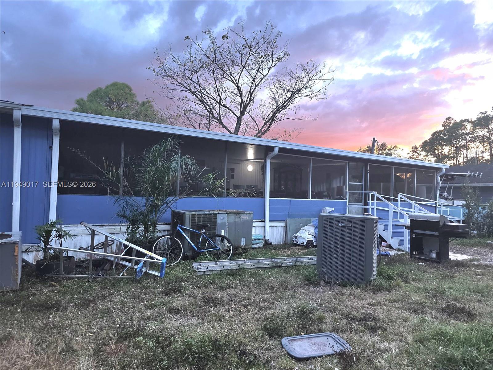 575 Vero Avenue Clewiston, FL 33440 - Photo 7 of 32 a view of a chair and table in backyard