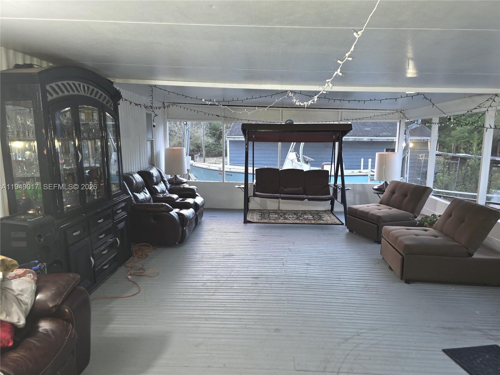 575 Vero Avenue Clewiston, FL 33440 - Photo 10 of 32 a living room with furniture and a fireplace