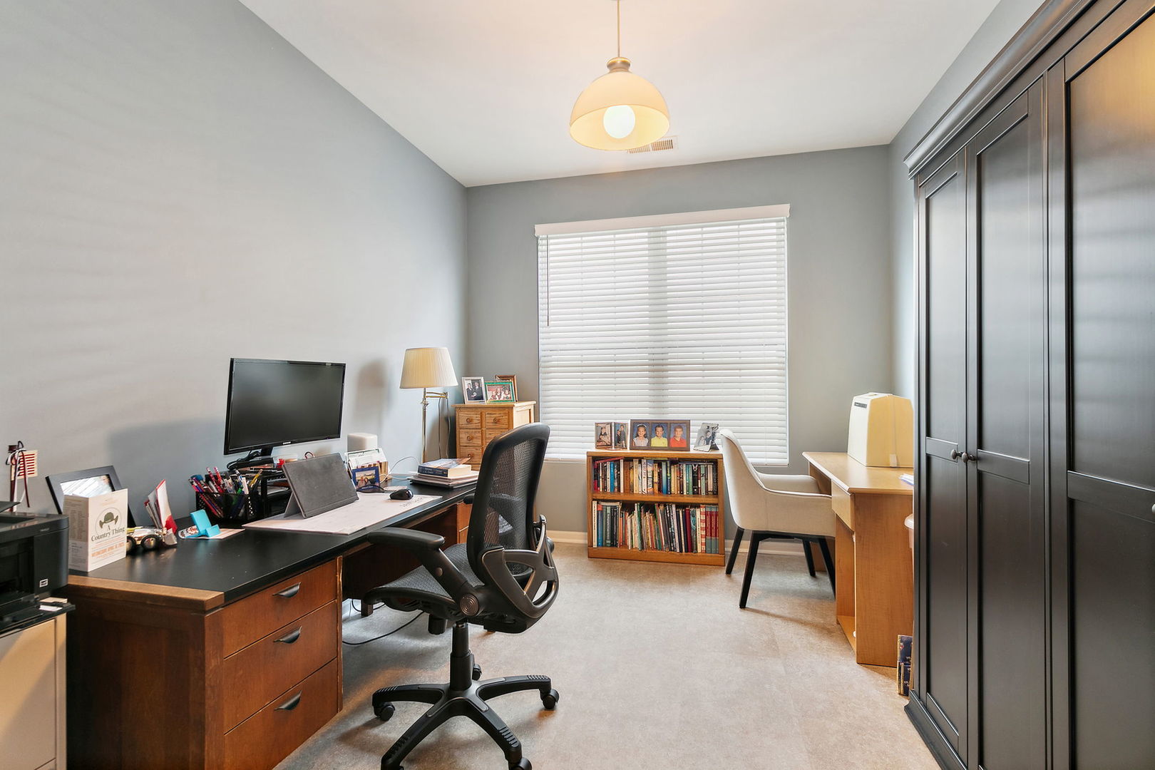 Undisclosed Address Elgin, IL 60124 - Photo 12 of 35 a view of a workspace with furniture and a window