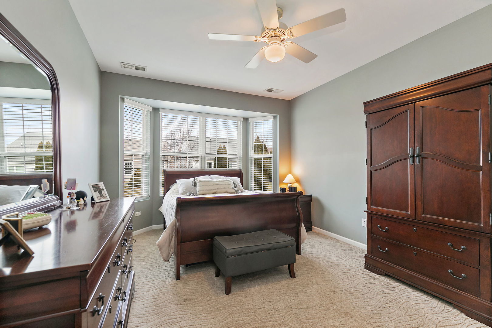 Undisclosed Address Elgin, IL 60124 - Photo 13 of 35 a bed room with a bed and a dresser