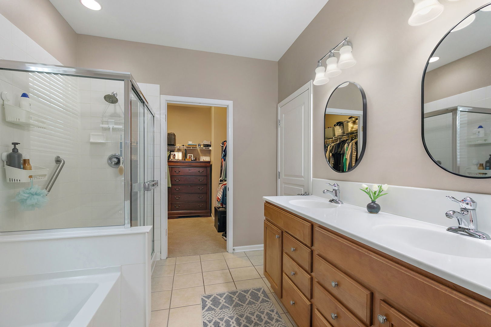 Undisclosed Address Elgin, IL 60124 - Photo 14 of 35 a bathroom with a double vanity sink mirror and shower