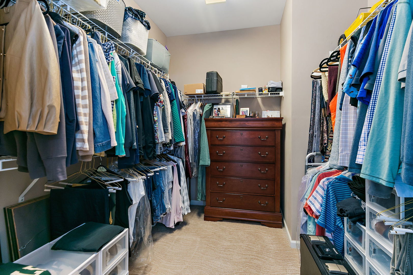 Undisclosed Address Elgin, IL 60124 - Photo 16 of 35 a view of walk in closet with clothes