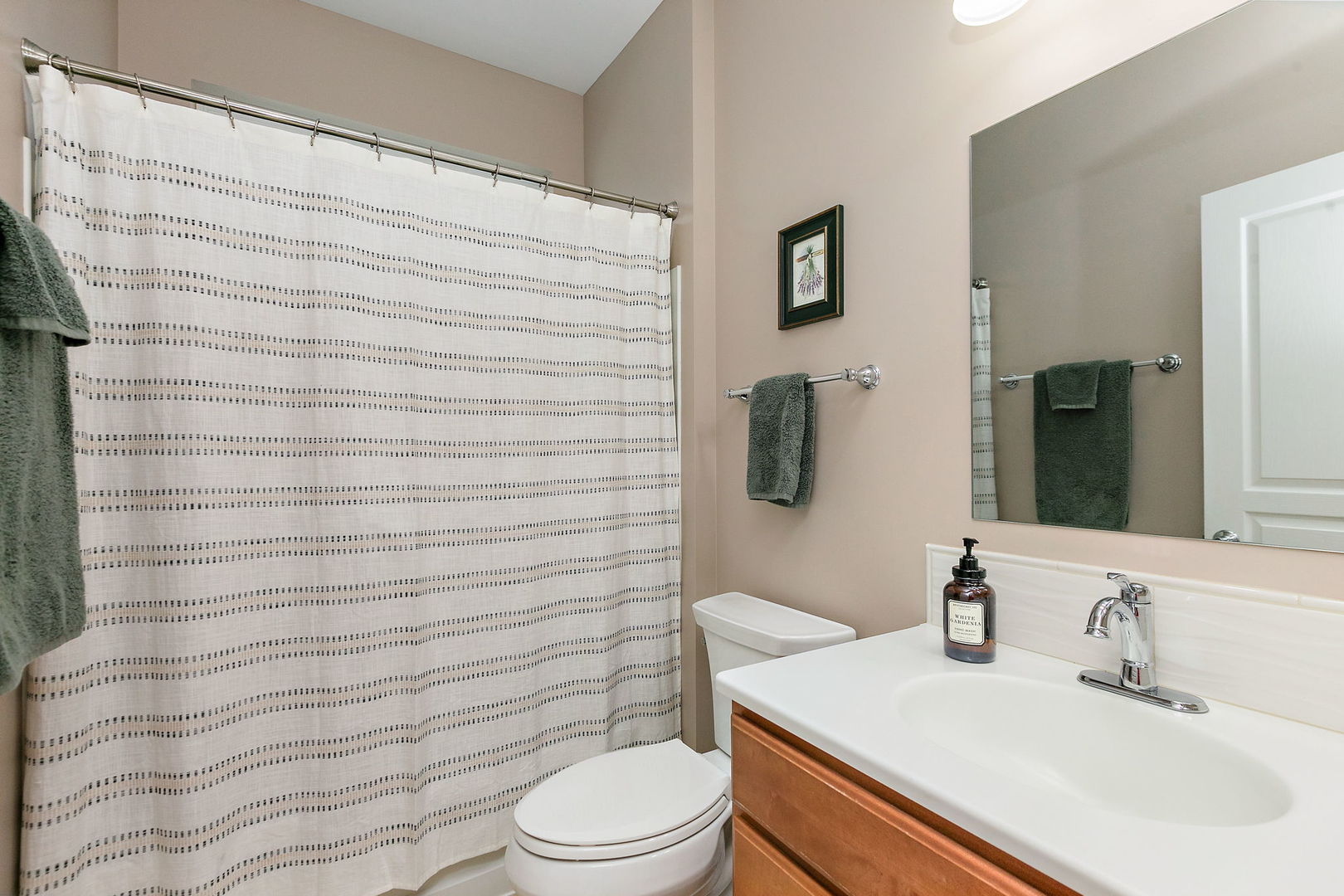 Undisclosed Address Elgin, IL 60124 - Photo 18 of 35 a bathroom with a sink a toilet and shower