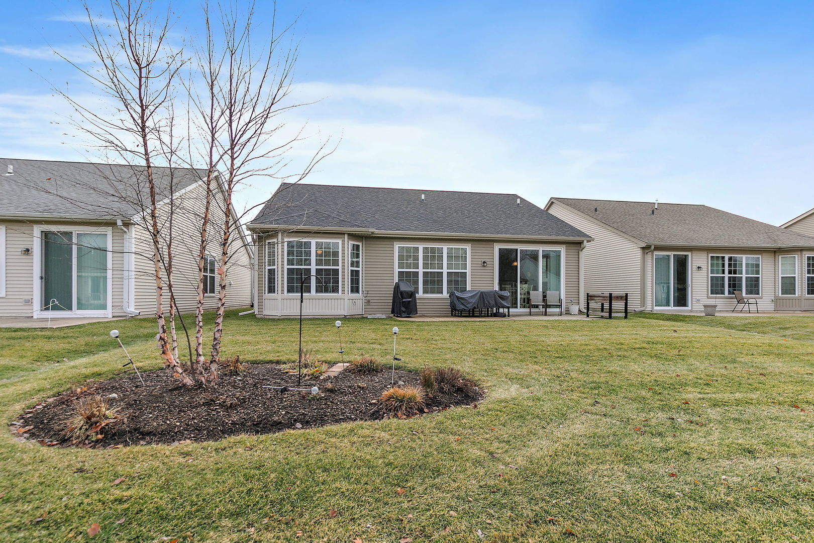 Undisclosed Address Elgin, IL 60124 - Photo 21 of 35 a front view of a house with a garden