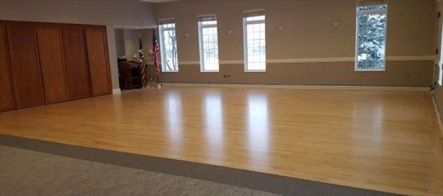 Undisclosed Address Elgin, IL 60124 - Photo 30 of 35 a view of an empty room with wooden floor and a window