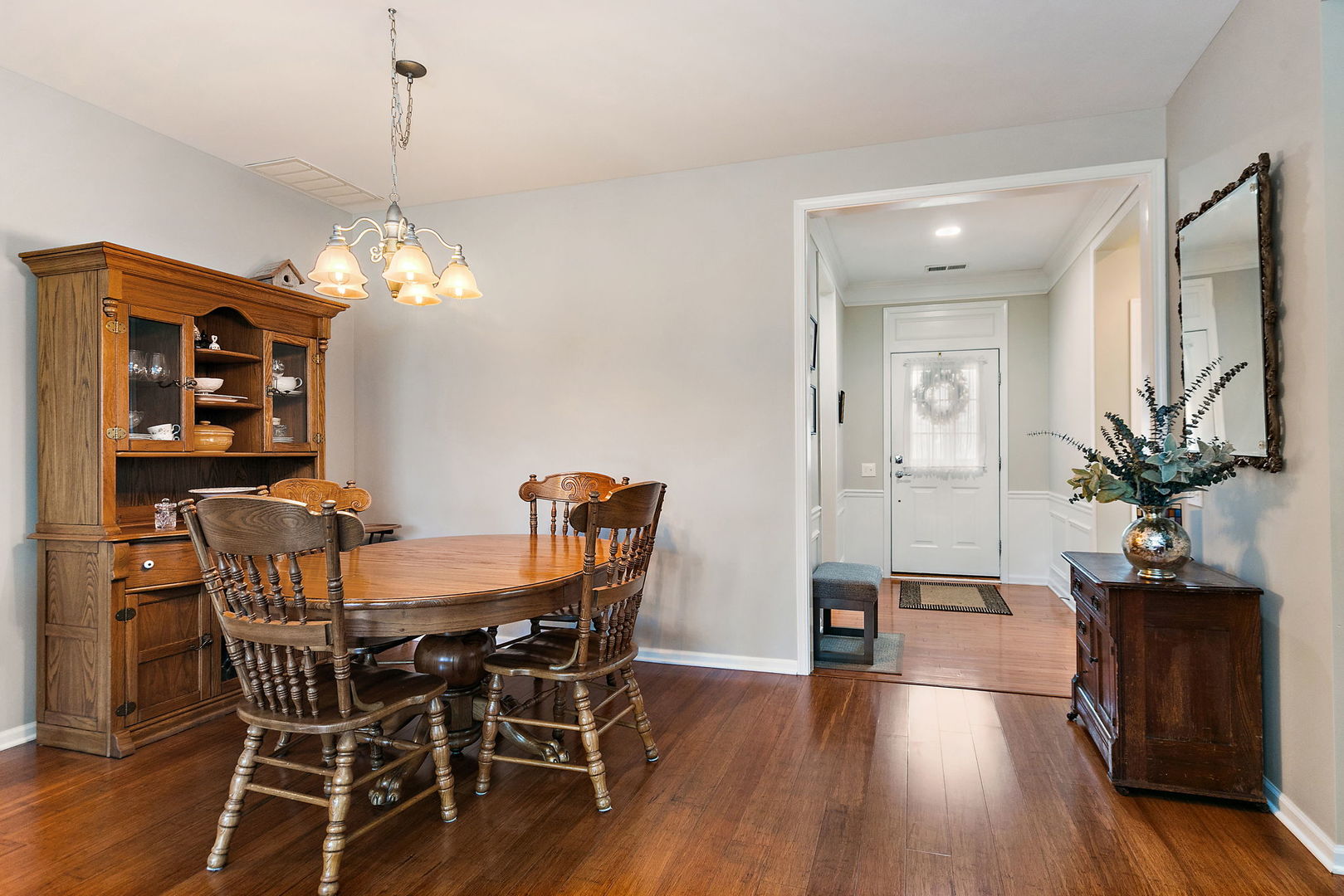 Undisclosed Address Elgin, IL 60124 - Photo 4 of 35 a view of a dining room with furniture and wooden floor