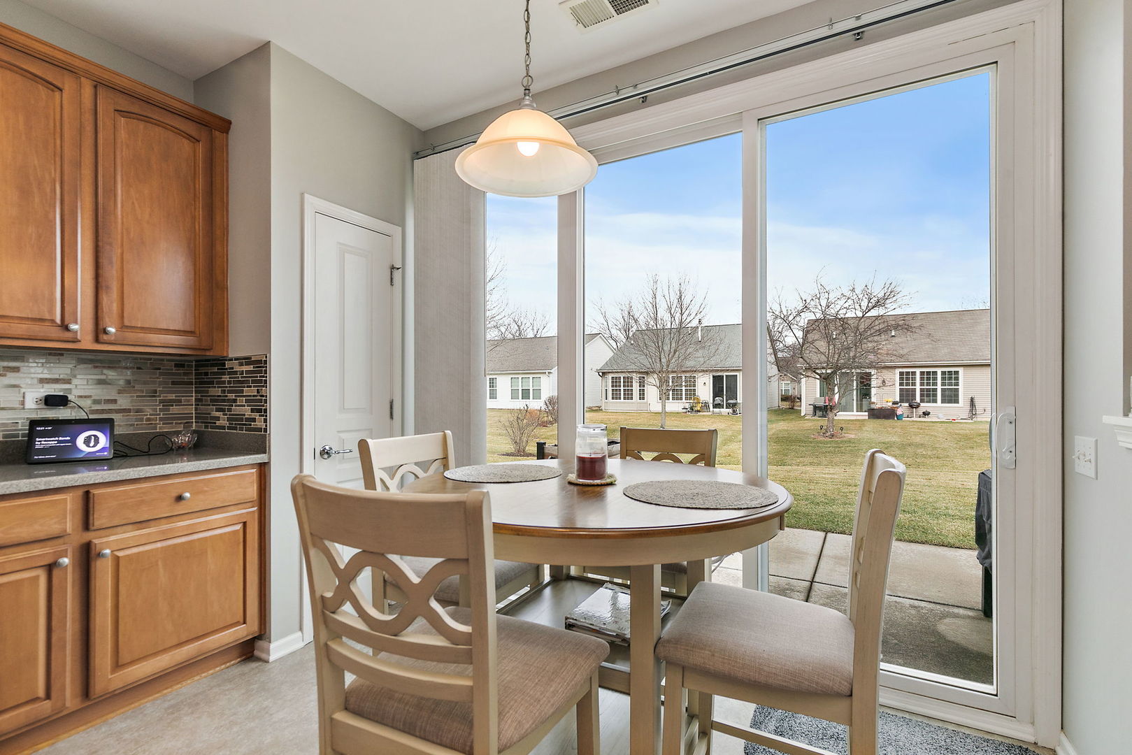 Undisclosed Address Elgin, IL 60124 - Photo 8 of 35 a dining room with furniture a chandelier and wooden floor