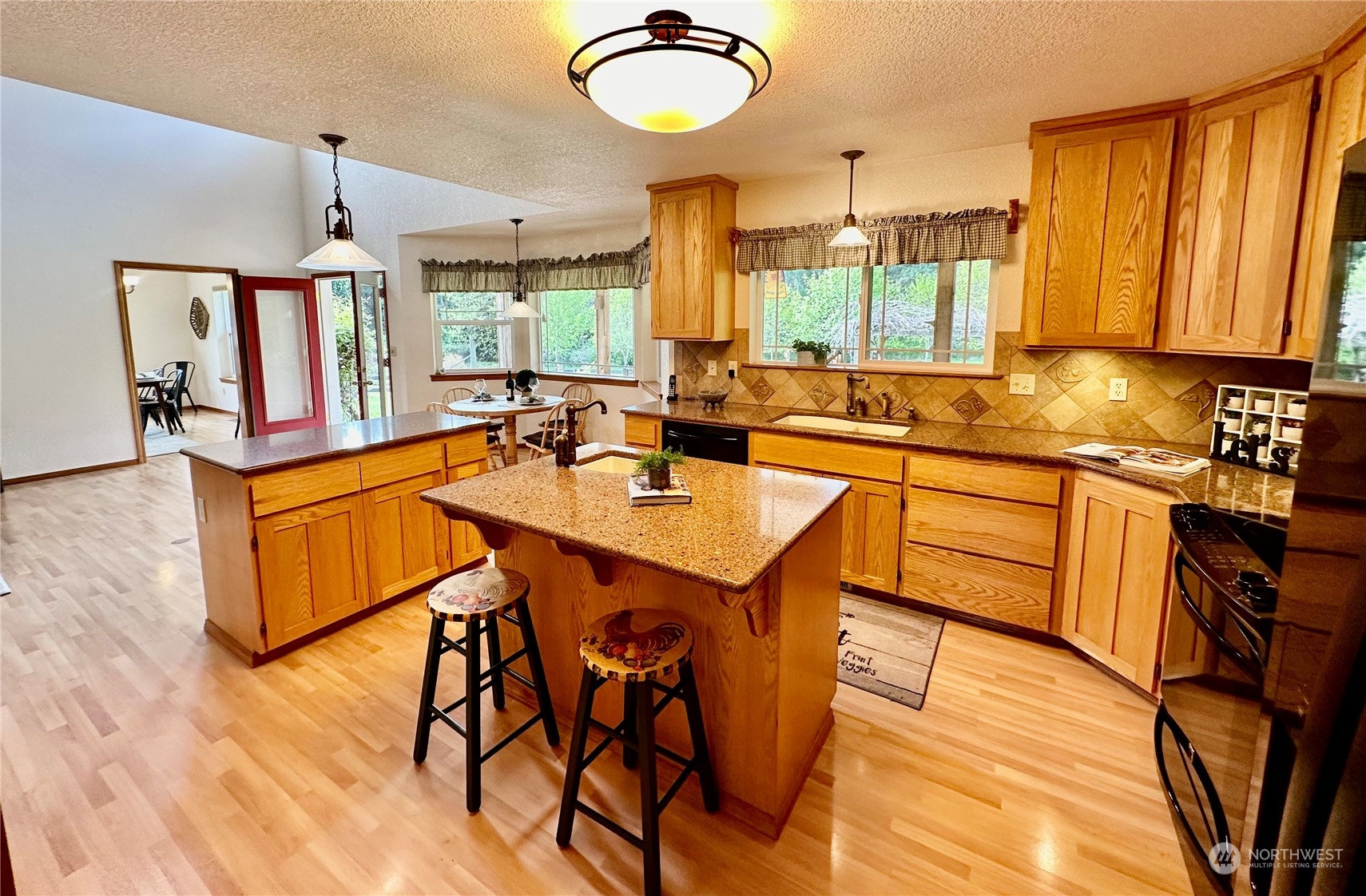 778 Ceres Hill Road, Unit B Chehalis, WA 98532 - Photo 13 of 40 a kitchen with sink cabinets and dining table
