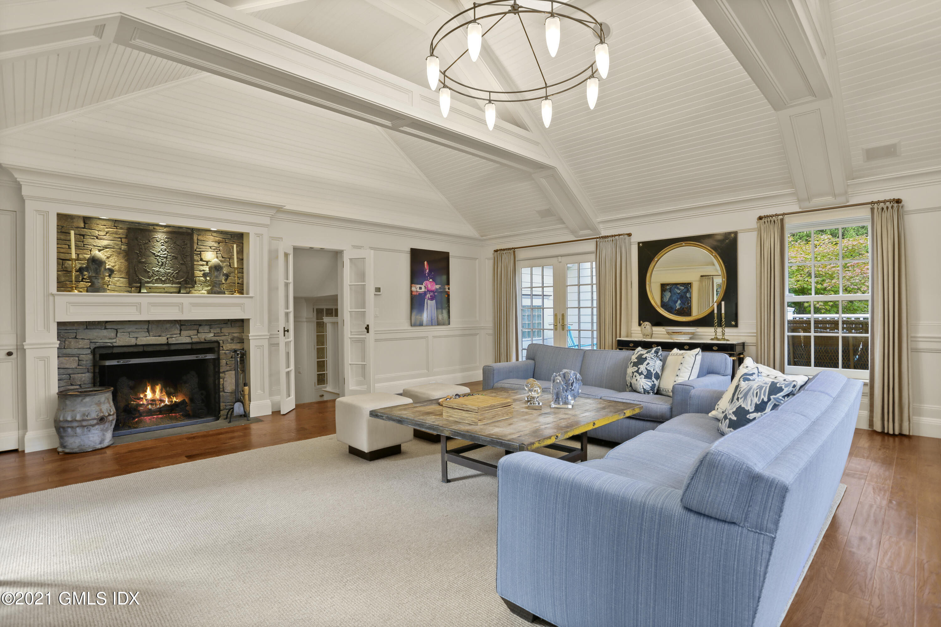 5 Tinker Lane Greenwich, CT 06830 - Photo 14 of 44 a living room with furniture and a fireplace