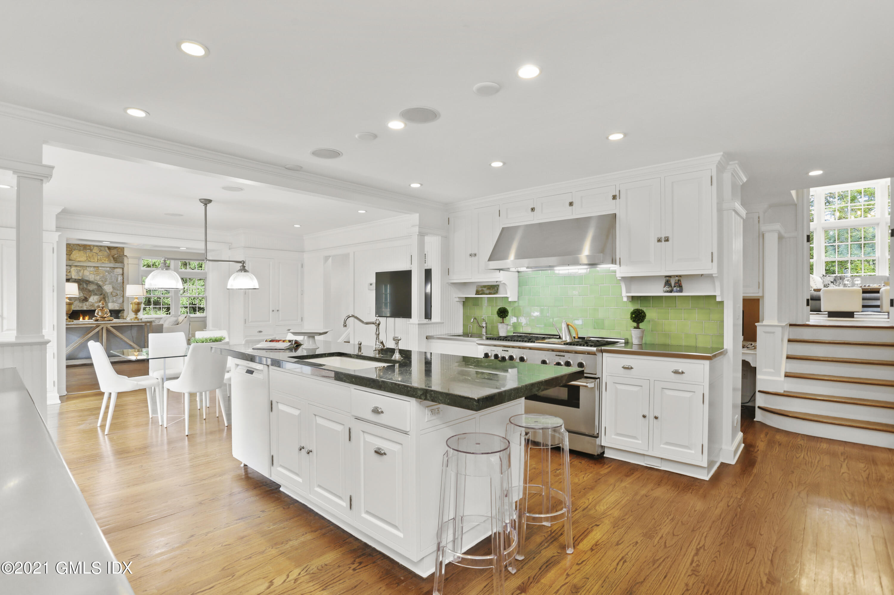 5 Tinker Lane Greenwich, CT 06830 - Photo 17 of 44 a kitchen with white cabinets and white appliances