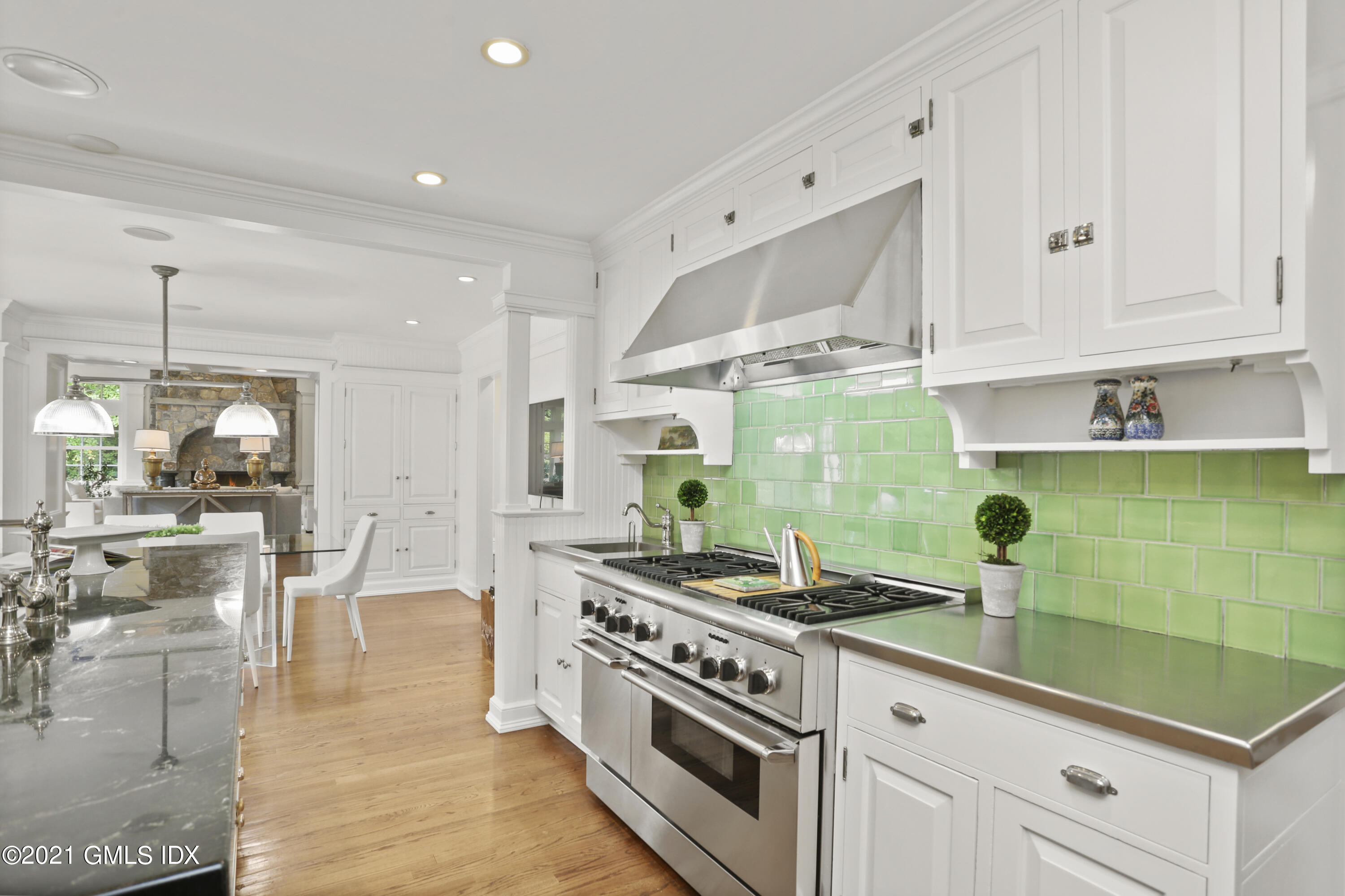 5 Tinker Lane Greenwich, CT 06830 - Photo 18 of 44 a kitchen with stainless steel appliances granite countertop a stove a sink and a white cabinets