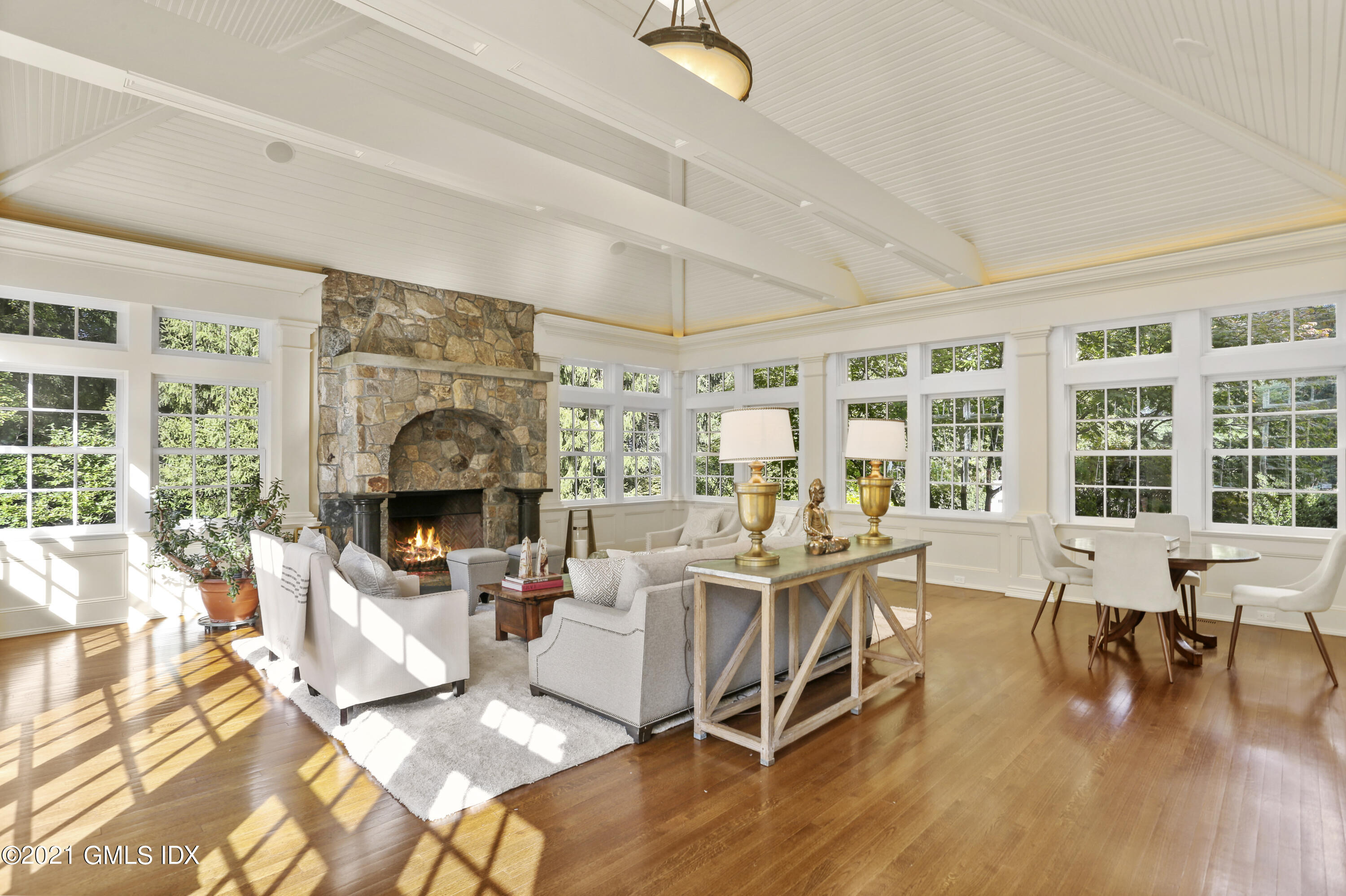 5 Tinker Lane Greenwich, CT 06830 - Photo 22 of 44 a living room with fireplace furniture and a large window