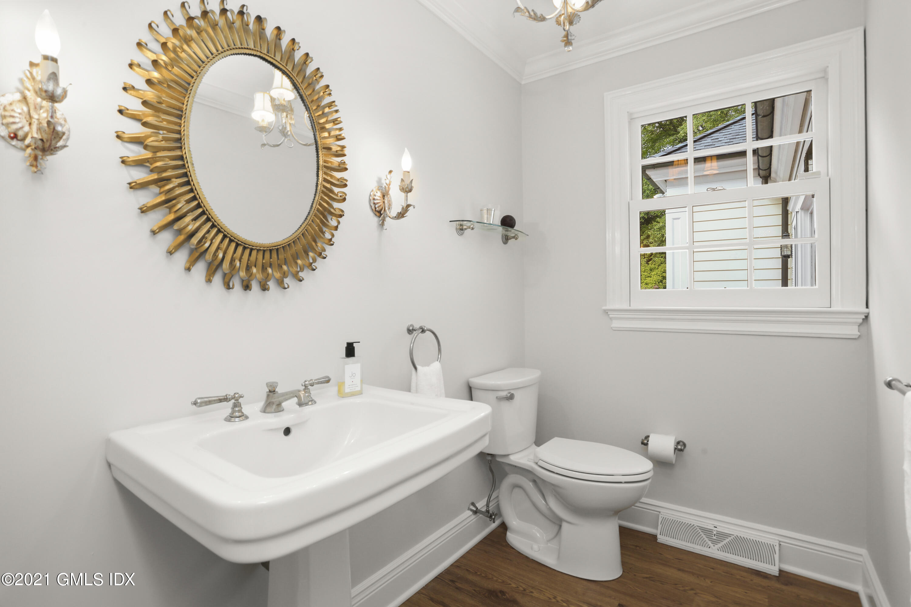 5 Tinker Lane Greenwich, CT 06830 - Photo 25 of 44 a bathroom with a sink and a mirror