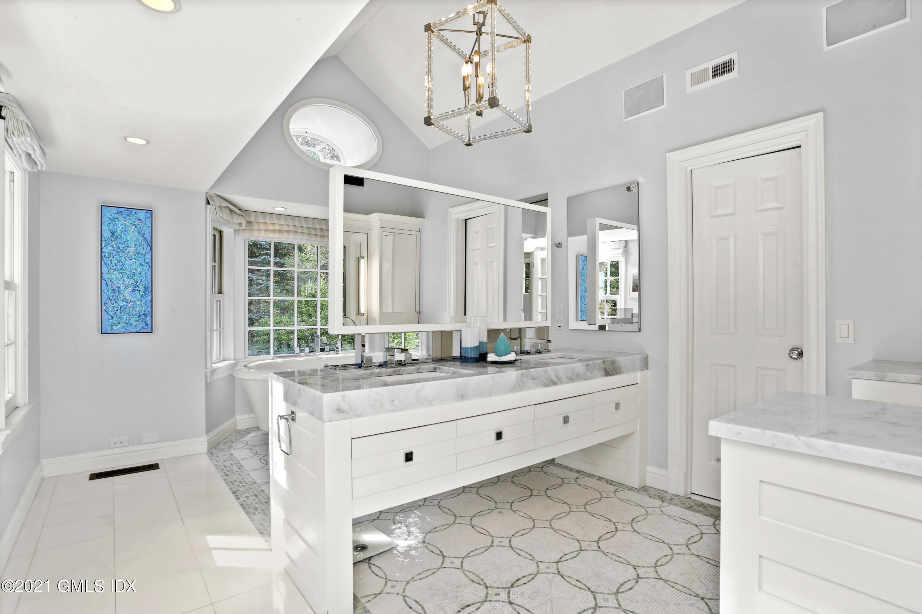 5 Tinker Lane Greenwich, CT 06830 - Photo 28 of 44 a spacious bathroom with a granite countertop sink mirror and a