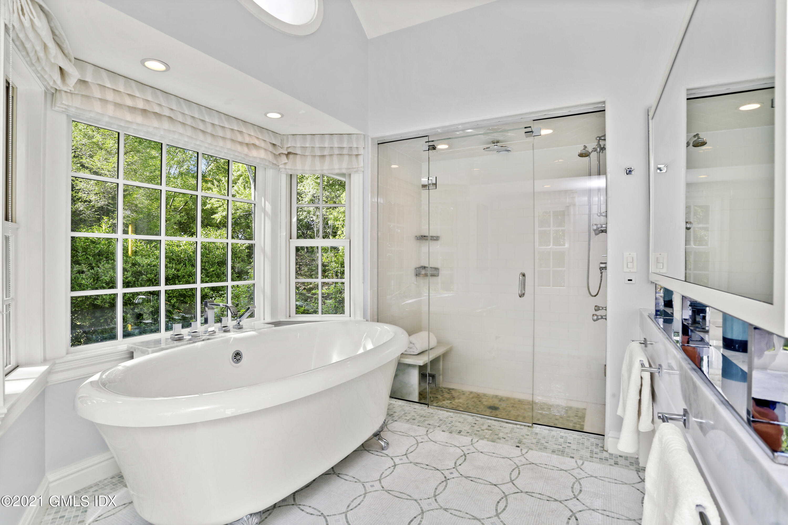 5 Tinker Lane Greenwich, CT 06830 - Photo 29 of 44 a bathroom with a bathtub and a shower