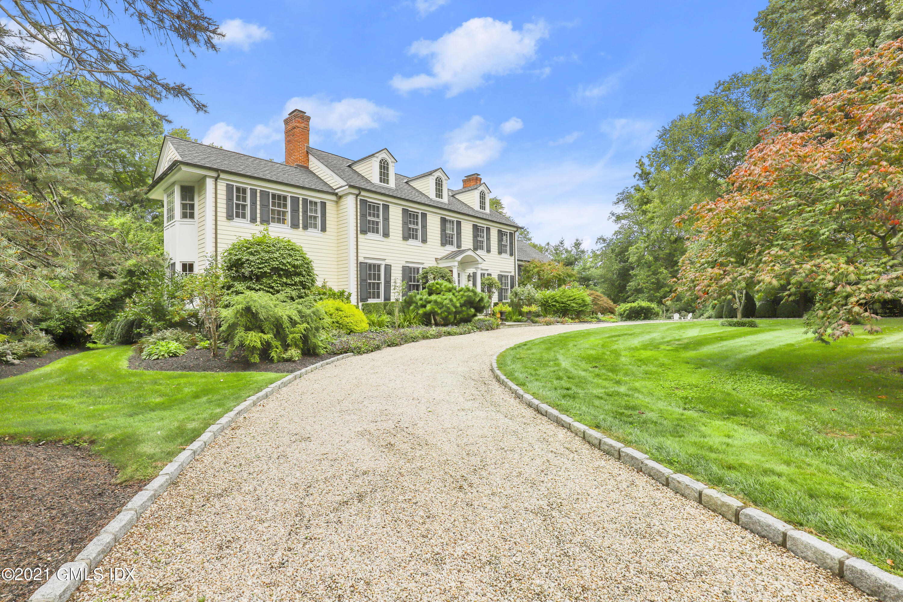 5 Tinker Lane Greenwich, CT 06830 - Photo 3 of 44 a view of a garden with a house