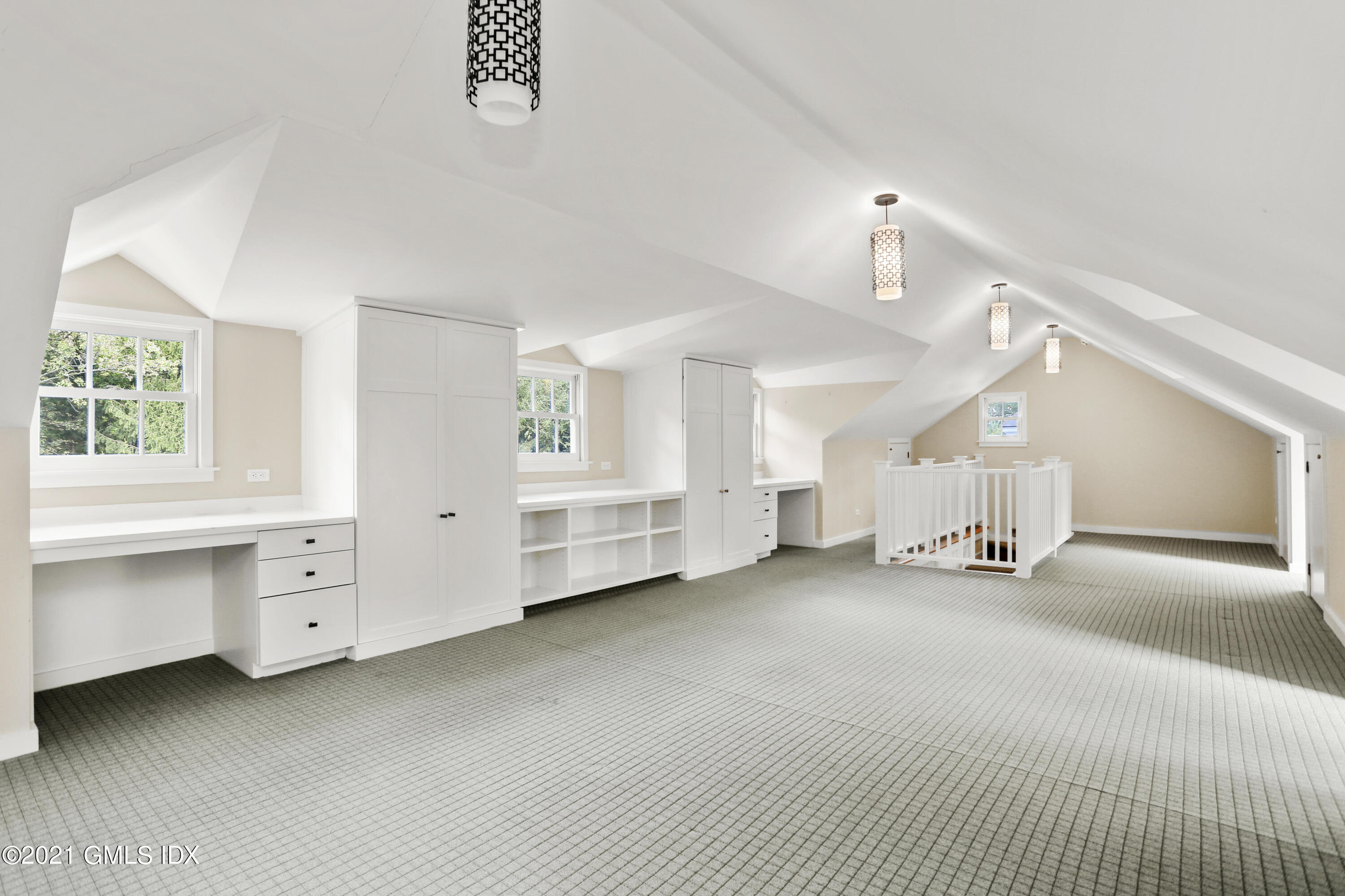 5 Tinker Lane Greenwich, CT 06830 - Photo 32 of 44 a big room with chandelier and windows