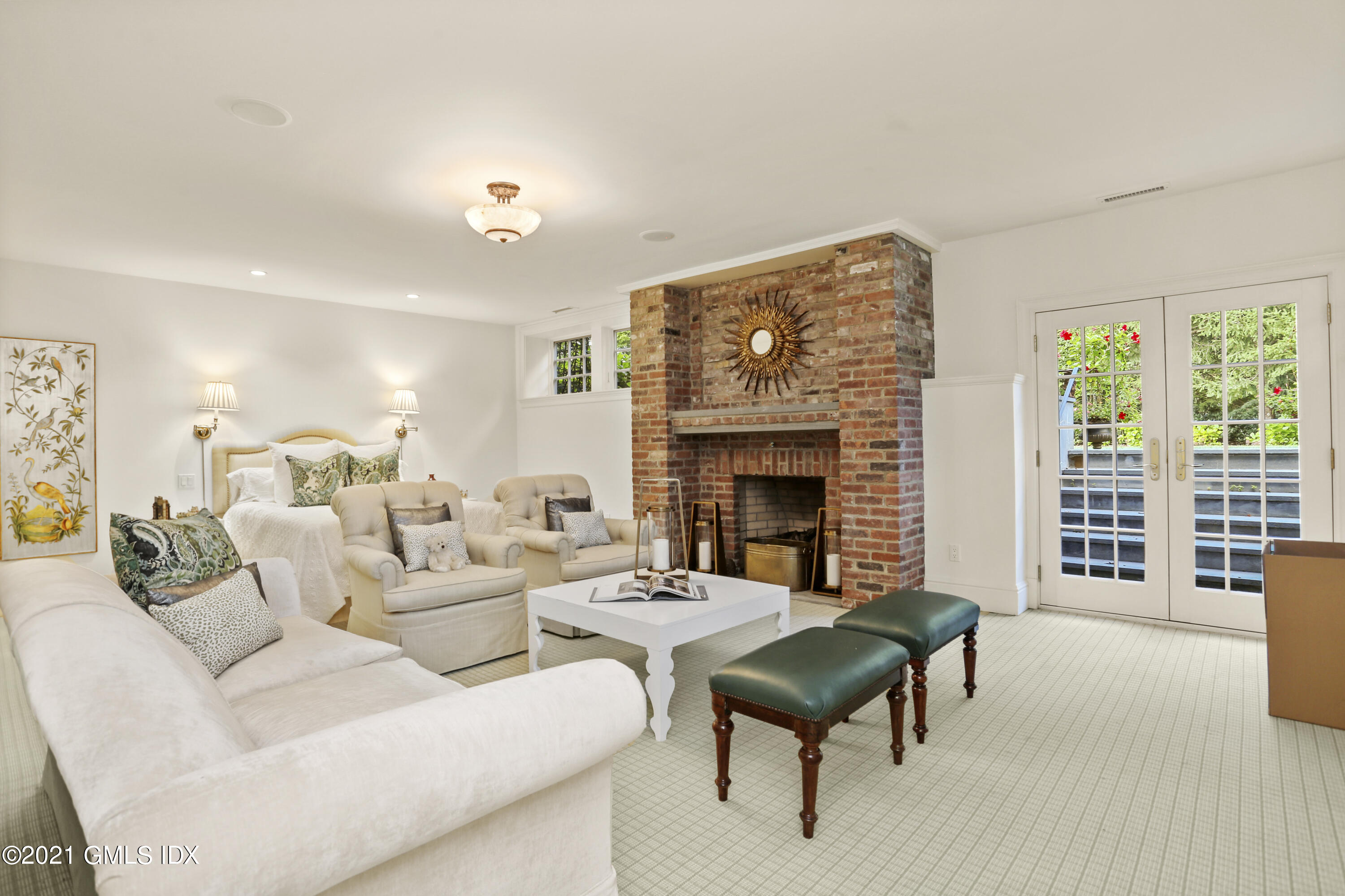 5 Tinker Lane Greenwich, CT 06830 - Photo 33 of 44 a living room with furniture and a fireplace