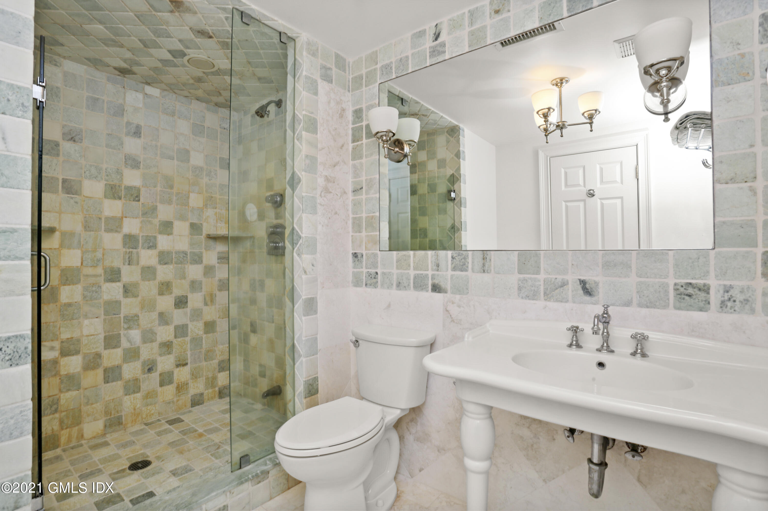 5 Tinker Lane Greenwich, CT 06830 - Photo 34 of 44 a bathroom with a sink toilet and shower