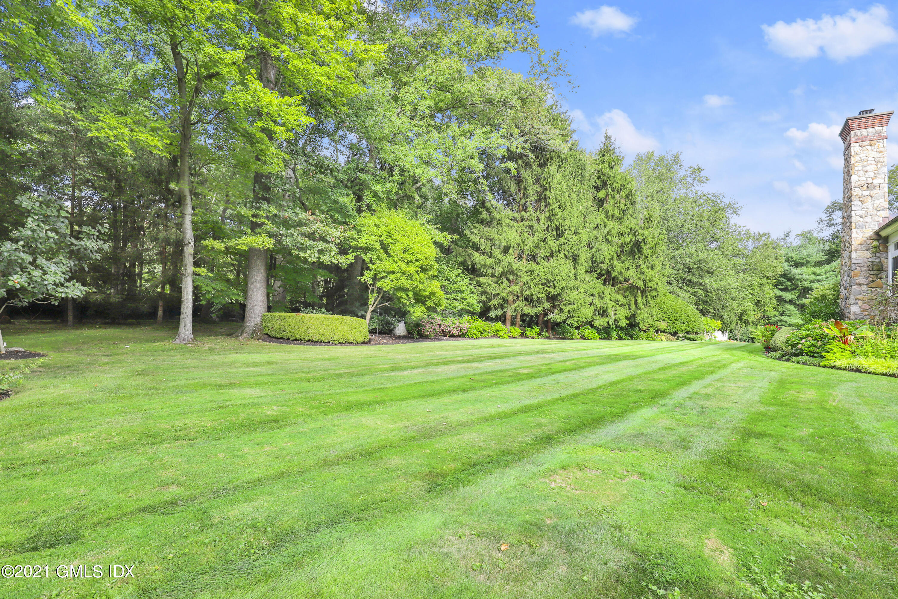 5 Tinker Lane Greenwich, CT 06830 - Photo 37 of 44 a view of a park with a tree in the background