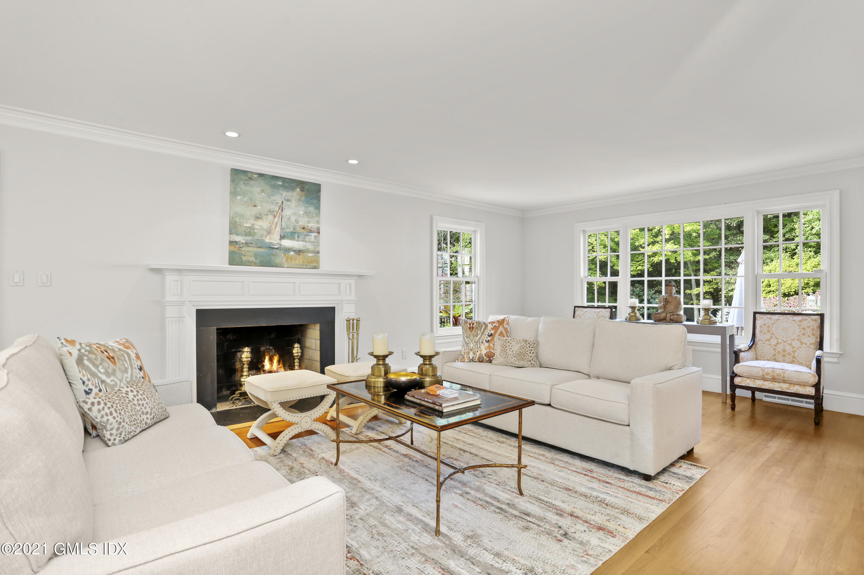 5 Tinker Lane Greenwich, CT 06830 - Photo 5 of 44 a living room with furniture and a fireplace