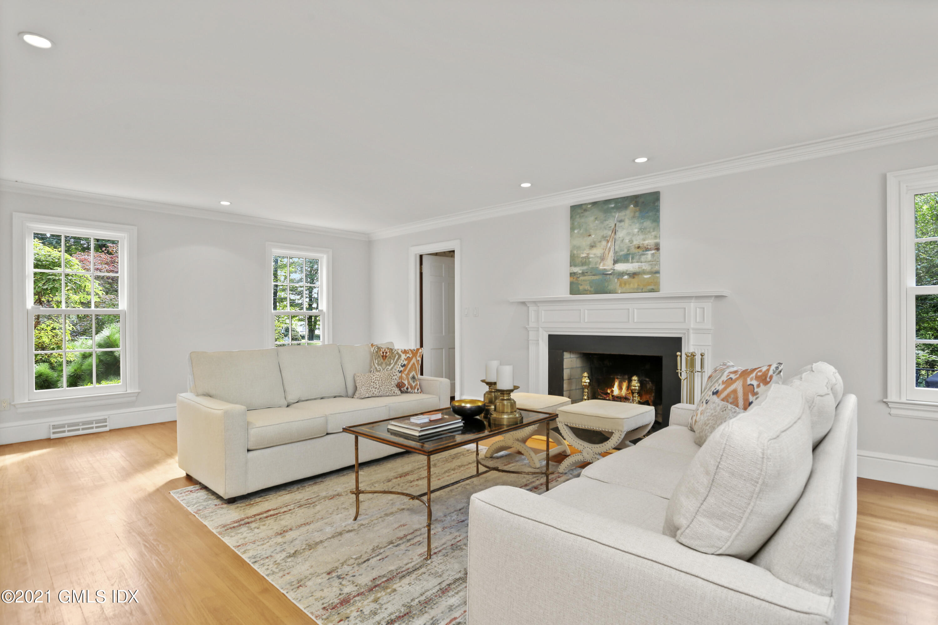 5 Tinker Lane Greenwich, CT 06830 - Photo 6 of 44 a living room with furniture and a fireplace