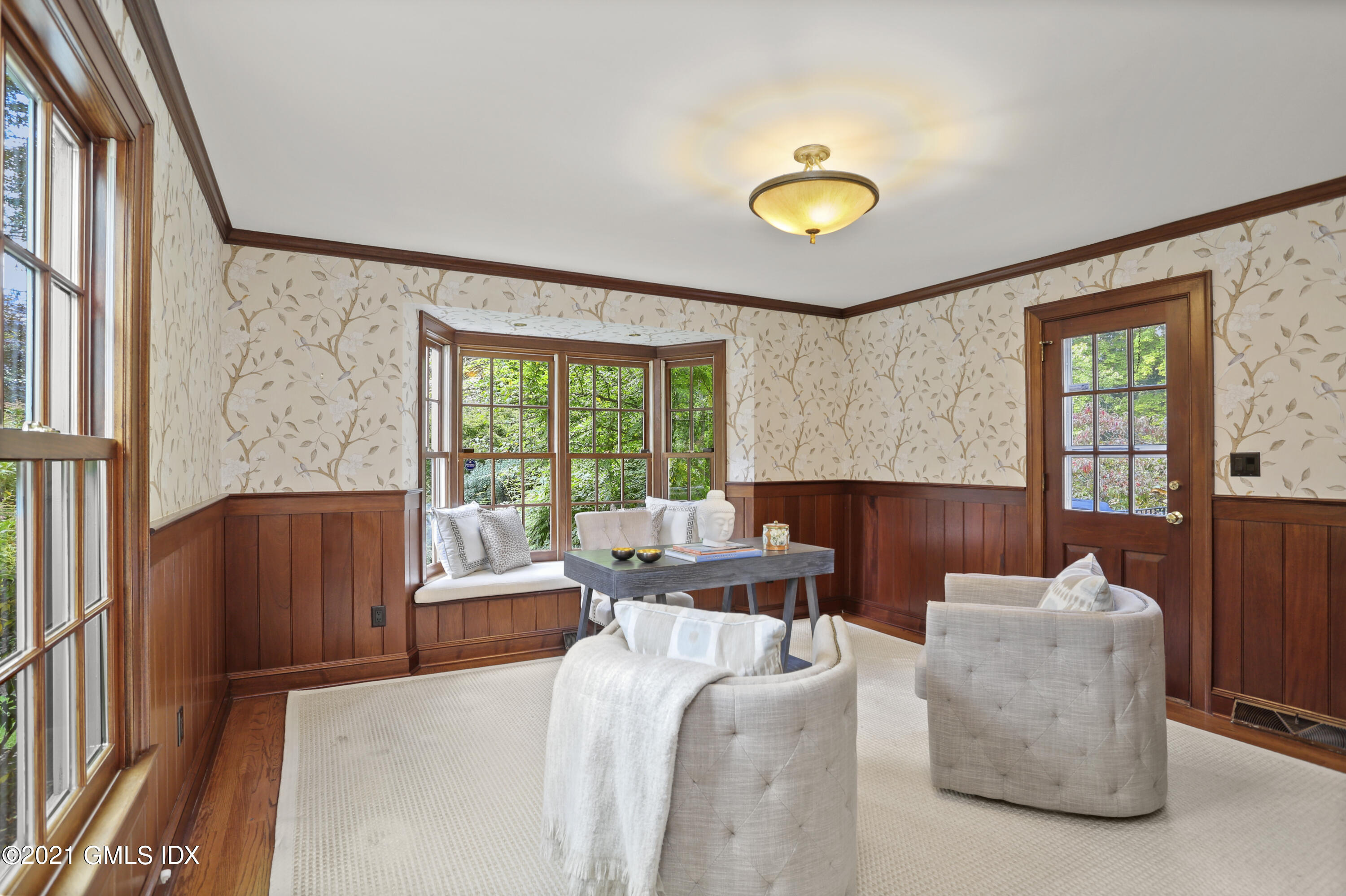 5 Tinker Lane Greenwich, CT 06830 - Photo 7 of 44 a living room with furniture and a large window