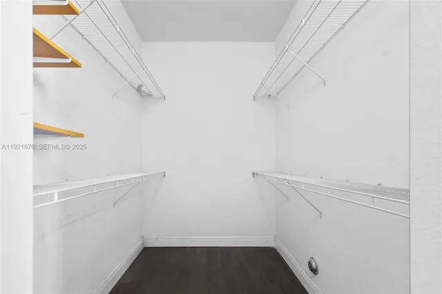 a spacious bathroom with a shower sink and mirror