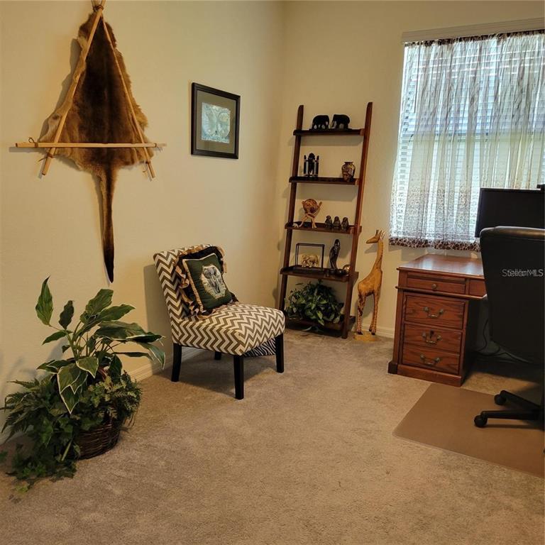17335 Blue Ridge Place Bradenton, FL 34211 - Photo 18 of 44 a bedroom with a bed and a window