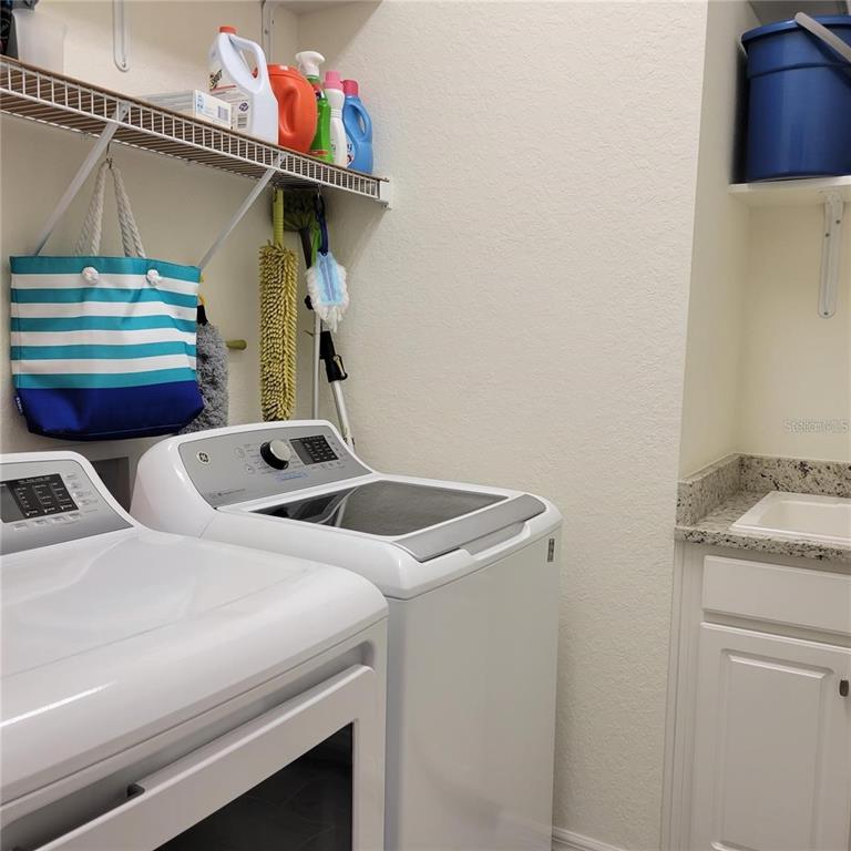17335 Blue Ridge Place Bradenton, FL 34211 - Photo 20 of 44 a utility room with dryer and washer