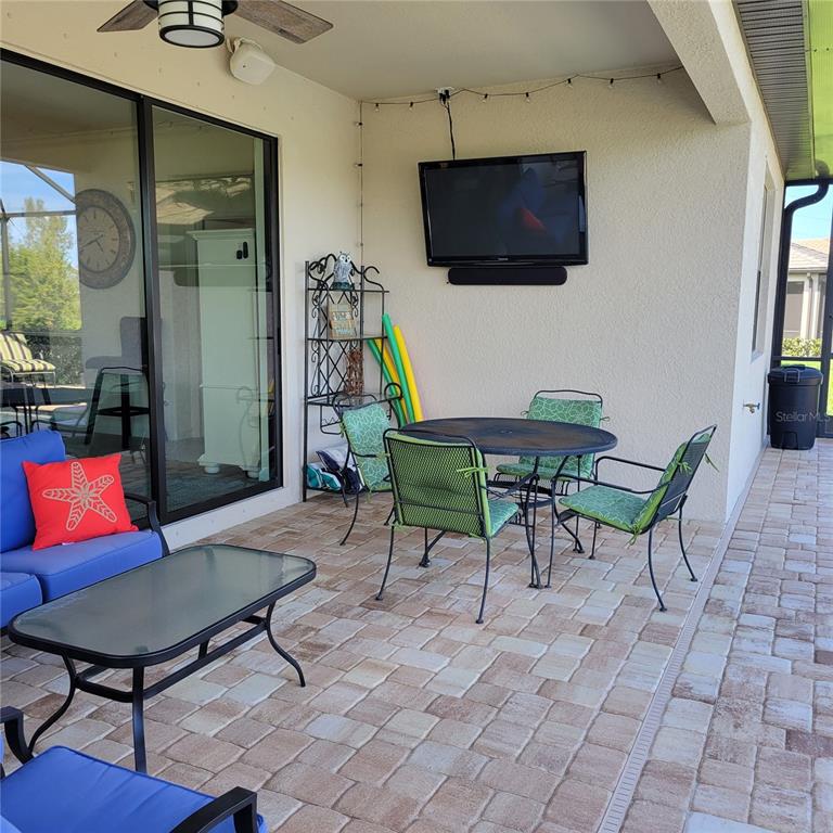 17335 Blue Ridge Place Bradenton, FL 34211 - Photo 24 of 44 a outdoor living space with furniture and a flat screen tv