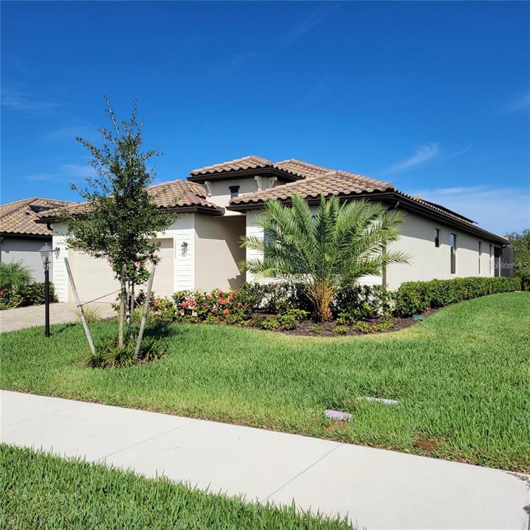 17335 Blue Ridge Place Bradenton, FL 34211 - Photo 3 of 44 a view of a house with a yard