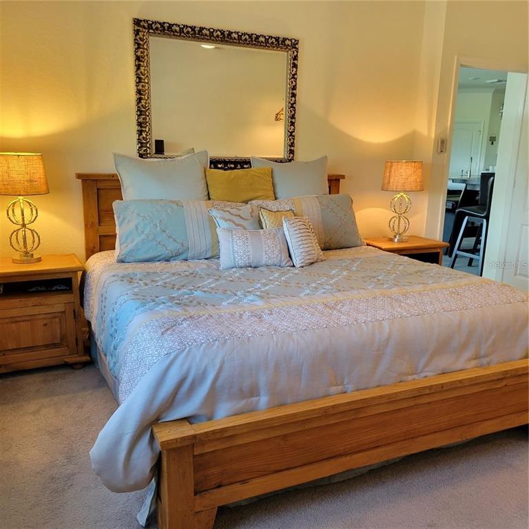 17335 Blue Ridge Place Bradenton, FL 34211 - Photo 10 of 44 a bedroom with a bed and wooden floor
