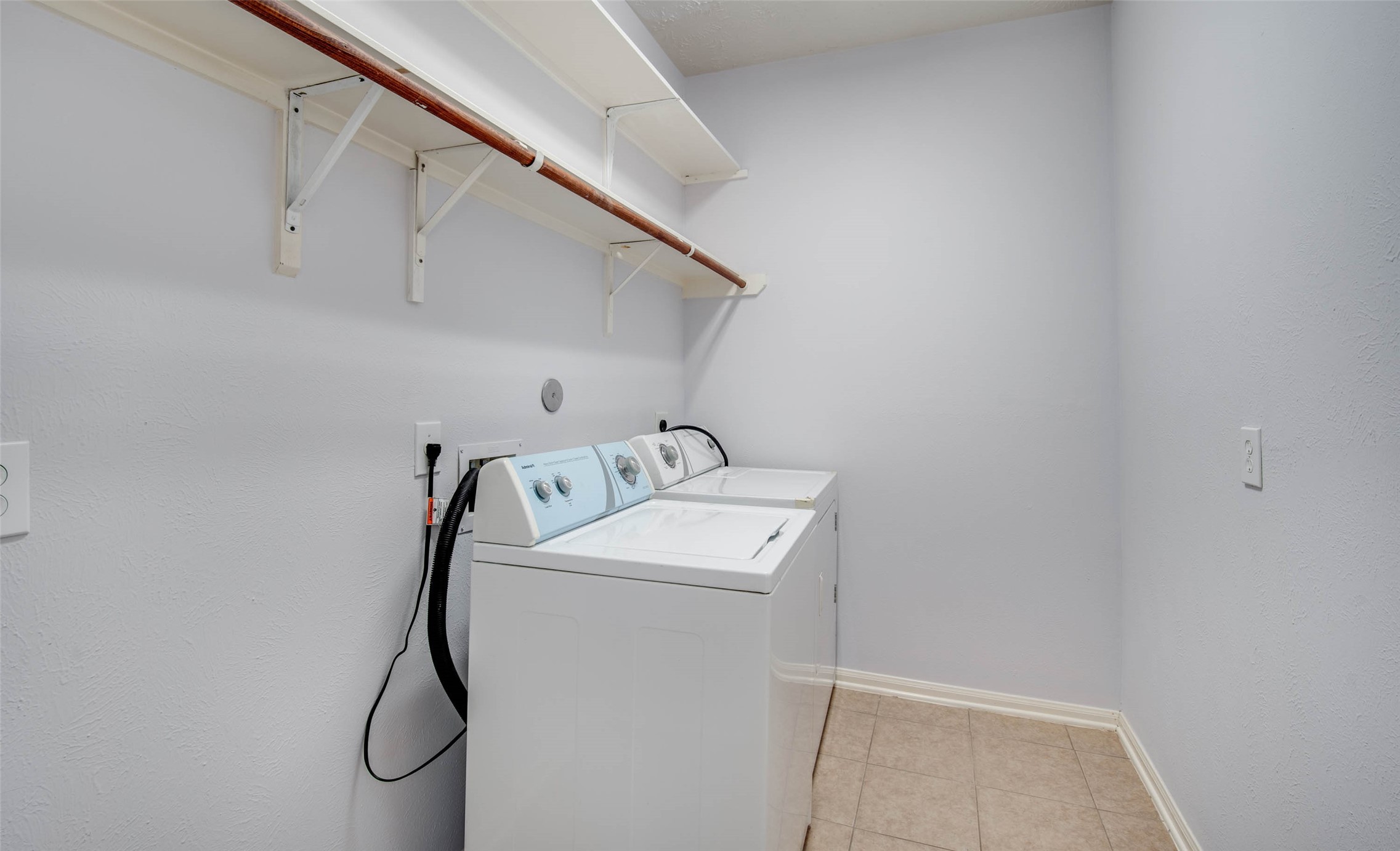 9323 Hillhaven Court Rosenberg, TX 77469 - Photo 34 of 37 a utility room with dryer and washer