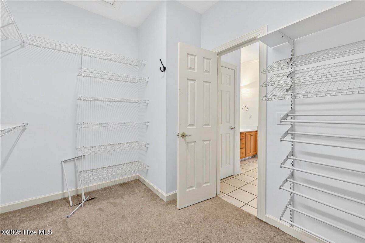 8985 Woodbine Road Southwest Sunset Beach, NC 28468 - Photo 35 of 65 Large walk in closet in primary bedroom