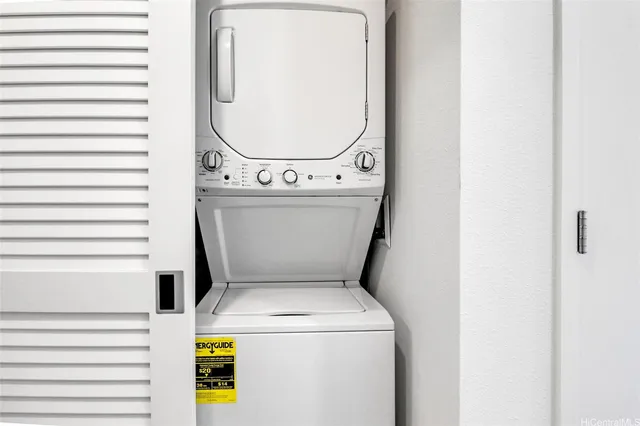 a view of a hallway with closet and wooden floor