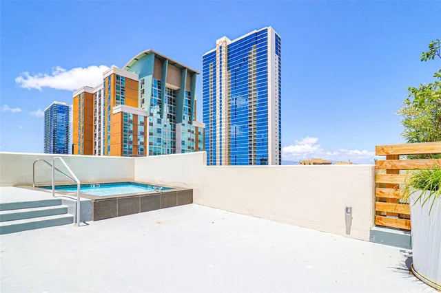 a view of a swimming pool with lawn chairs