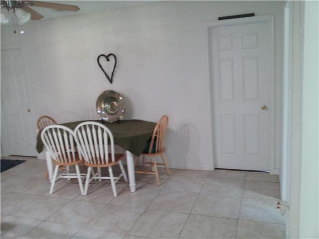 417 Apache Lane Boca Raton, FL 33487 - Photo 13 of 13 a view of a dining room with furniture