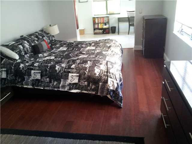 417 Apache Lane Boca Raton, FL 33487 - Photo 10 of 13 a bed sitting in a bedroom next to a window