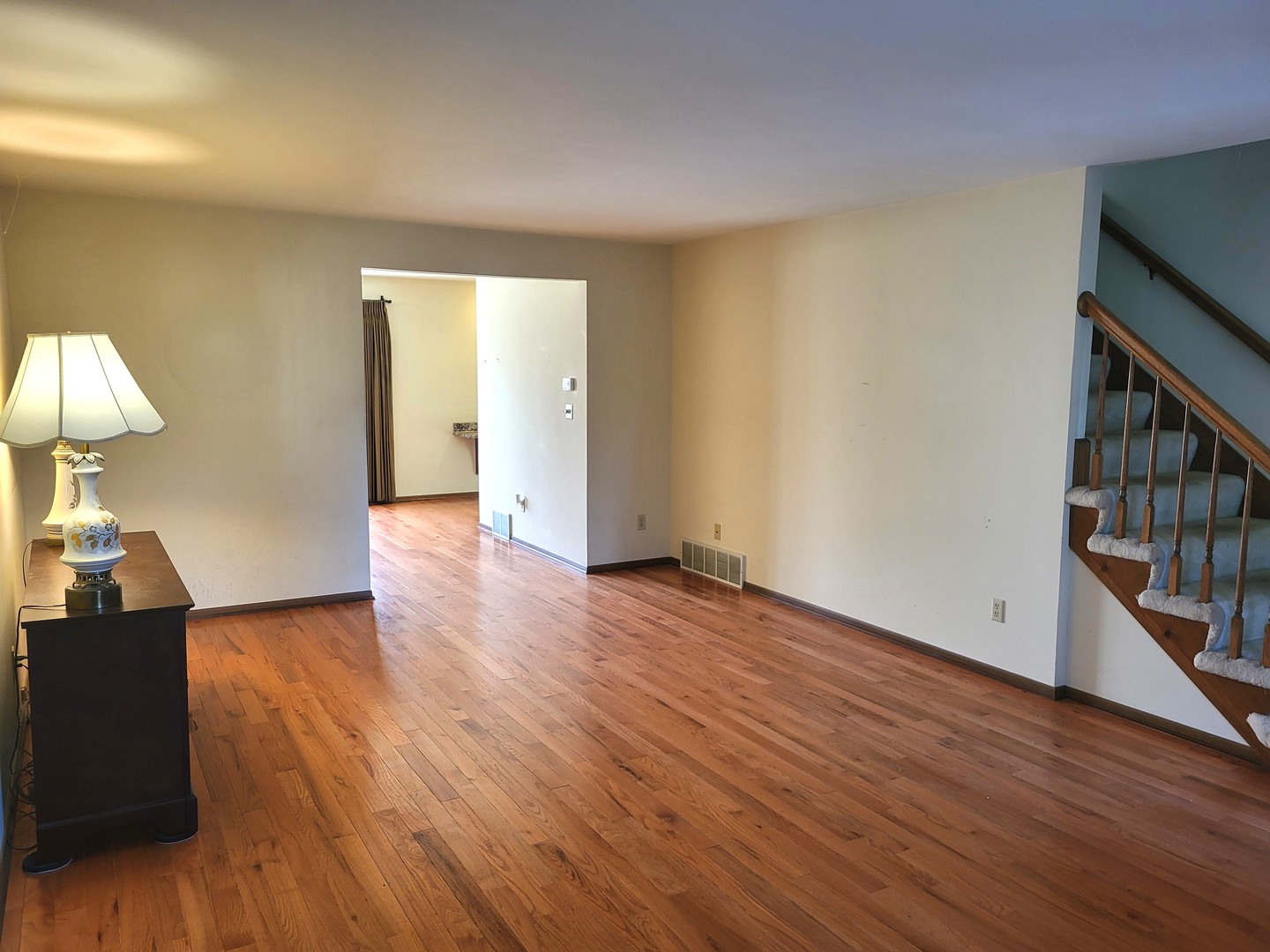 434 East Exchange Street, Unit 2 Sycamore, IL 60178 - Photo 2 of 15 a view of empty room with wooden floor and fan